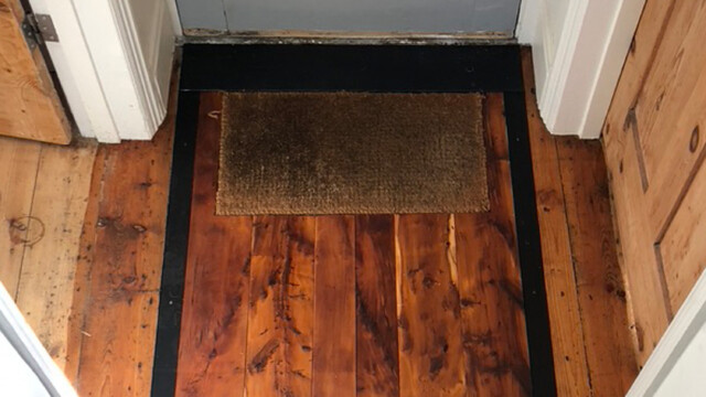 Oak flooring hand stained with a vinegar and iron solution